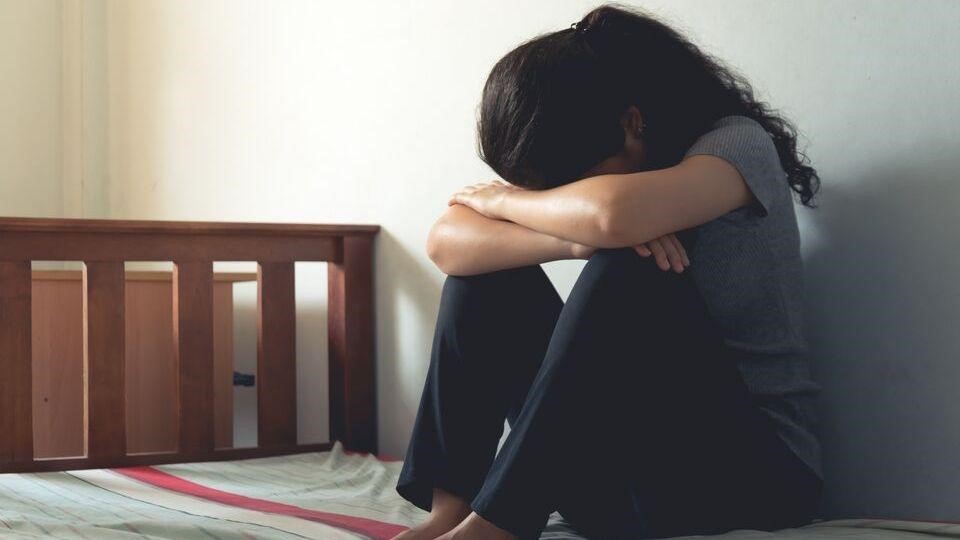 woman-hunched-over-sad Psychedelics and postpartum depression