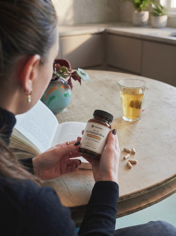 Ashwagandha ksm66 capsules in hand Ashwagandha ksm66 capsules in hand